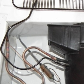 The condensor coil tubes are touching