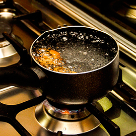 The openings on the burner crown have water in them